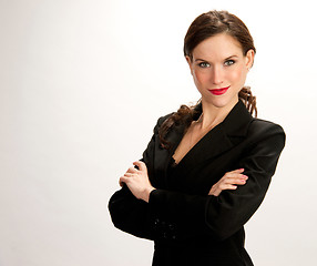 Image showing Focused Business Woman Looks Serious Business Suit Against White