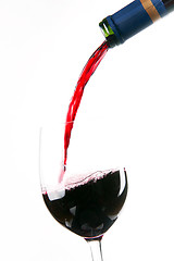 Image showing Red Burgundy Wine Pour Bottle Neck to Filled Glass