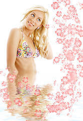 Image showing bikini blond #3 in water with flowers