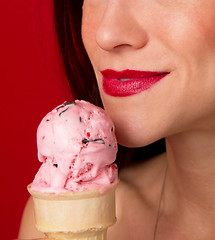 Image showing Female Lips Eating Strawberry Ice Cream Cone Red Lipstick