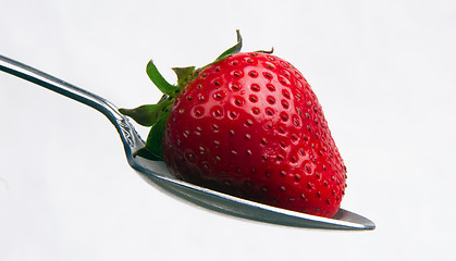 Image showing Red Raw Food Fruit Strawberry on a Silver Spoon