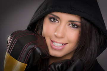 Image showing Beautiful Boxer Female in Black Hoodie Wearing Practice Gloves 