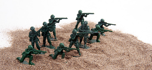 Image showing Toy Army Men in Pile of Sand