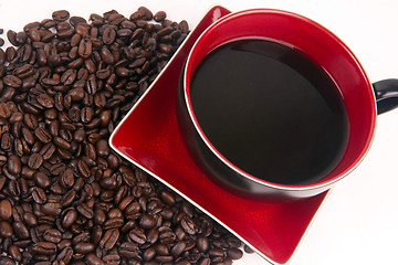 Image showing Mocha Java Red Porcelain Coffe Cup Sitting in Roasted Beans