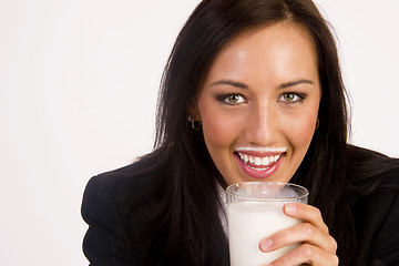 Image showing Attractive Brunette Female Drinks and Gets a Milk Mustache