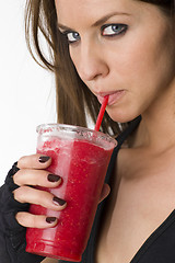 Image showing Blue Eyed Woman Enjoys Red Fruit Food Ice Smoothie