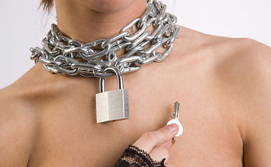 Image showing Chastity Chain Around Woman's Neck Padlock Key
