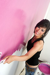 Image showing Woman Smiling While Do it Yourself Paint the Walls Home Project