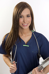 Image showing Vibrant Female Nurse With Stethoscope and Chart Making Rounds