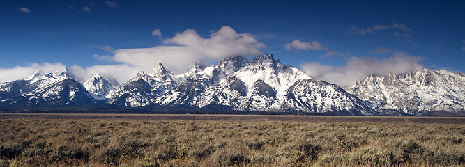 Image showing Jagged Peaks Grand Teton Wyoming Bright Sun Snow Clouds