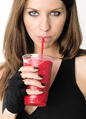 Image showing Girl with Refreshing Red Fruit Smoothie after Gym Workout