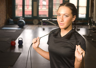 Image showing Healthy Fit Woman Stands after Rope Work at Fitness Boot Camp