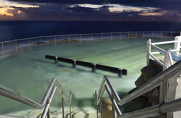 Image showing Bronte pool, lit up at dawn before sunrise