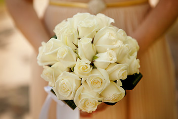 Image showing Bride holding wedding flower bouquet