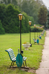 Image showing park bench in row, selective focus on first