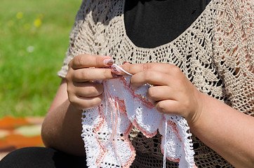 Image showing woman knits knitting needles rare knitted fabrics 