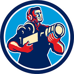 Image showing Cameraman Cradling Vintage Camera Circle Retro