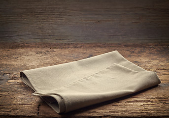 Image showing linen napkin on wooden table