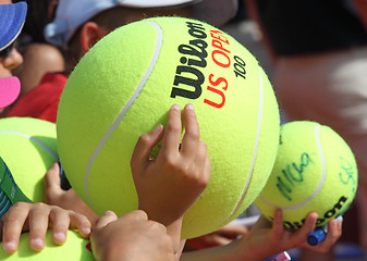 Image showing Children with big tennis balls 