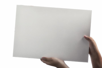 Image showing White Plastic laminate sign held up by hands