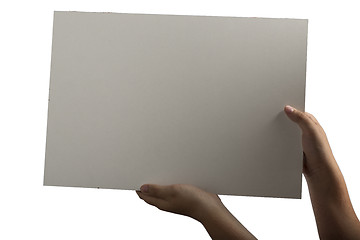 Image showing White Plastic laminate sign held up by hands