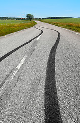 Image showing 	Tire print on the asphalt road