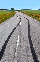 Image showing Tire print on the asphalt road