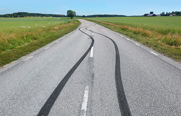 Image showing Tire print on the asphalt road 