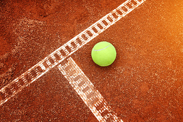 Image showing Yellow ball on the court ground