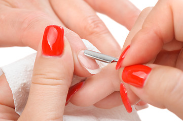 Image showing manicure applying - cleaning the cuticles 