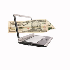 Image showing laptop and a flying dollar