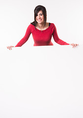 Image showing Female Presenter Stands Above Blank White Board Smiling Woman