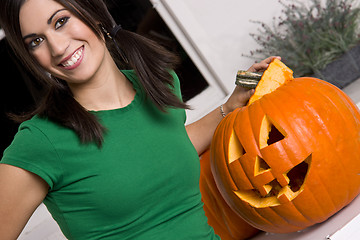 Image showing Happy Beautiful House Wife Pumkin Carver With Jack-o-Lantern