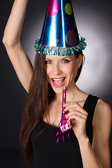 Image showing Happy Celebration Attractive Adult Woman Noise Maker Party Hat