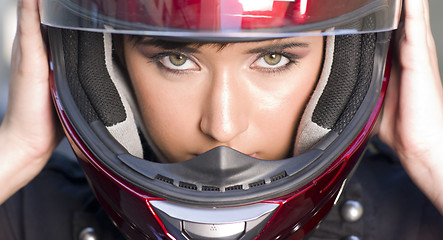 Image showing Attractive Girl Positions Red Full Face Helmet Before Motorcycle