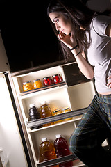 Image showing She gets Into the Fridge