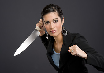 Image showing Woman in Business Jacket Wields Large Kitchen Knife Back Stabber