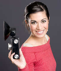 Image showing Vintage Photographer Holding Camera With Flash Attached