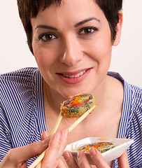 Image showing Candid Close Portrait Cute Brunette Woman Raw Food Sushi Lunch