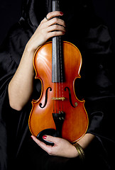 Image showing Important Violin Held in Manicured Hands