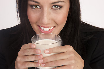 Image showing Attractive Young Woman Drinks Whole Milk From a Glass