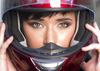 Image showing Girl With Pretty Green Eyes in Red Full Face Helmet