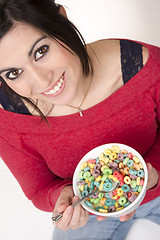 Image showing Happy Attractive Woman Eats Bowl Colorful Breakfast Cereal