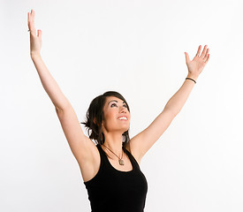 Image showing Pretty Brunette Woman Holds Arms Outstretched Jubilant Looking U