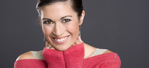 Image showing Beautiful Woman Excited With Hands Clinched Under Chin Red Sweat