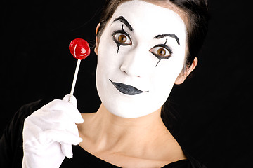 Image showing Beautiful Brunette Woman Mime Holds Lollipop Candy White Face