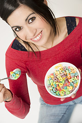 Image showing Happy Attractive Woman Eats Bowl Colorful Breakfast Cereal