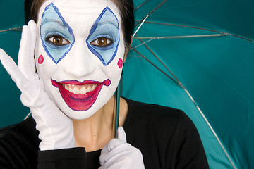 Image showing Excited Clown in White Face Holds Umbrella
