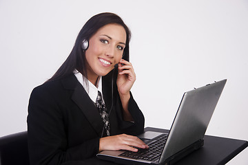 Image showing Attractive Young Woman Works Customer Service Computer Headset