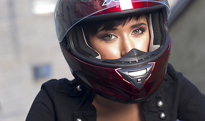Image showing Girl With Pretty Green Eyes in Red Full Face Helmet